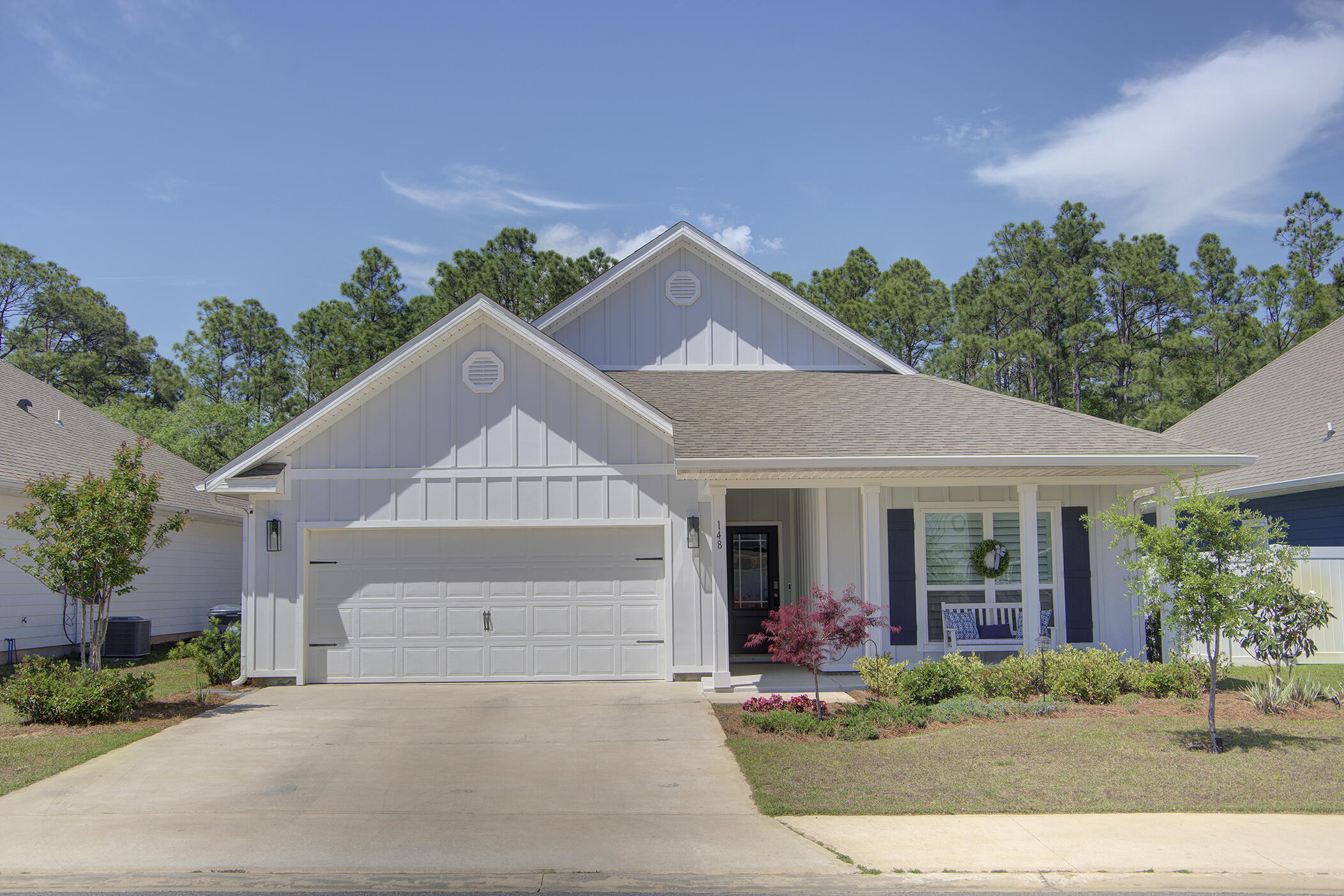 148 Piper Cove Santa Rosa Beach, FL 32459 - Photo 2 of 35 a front view of a house with garden