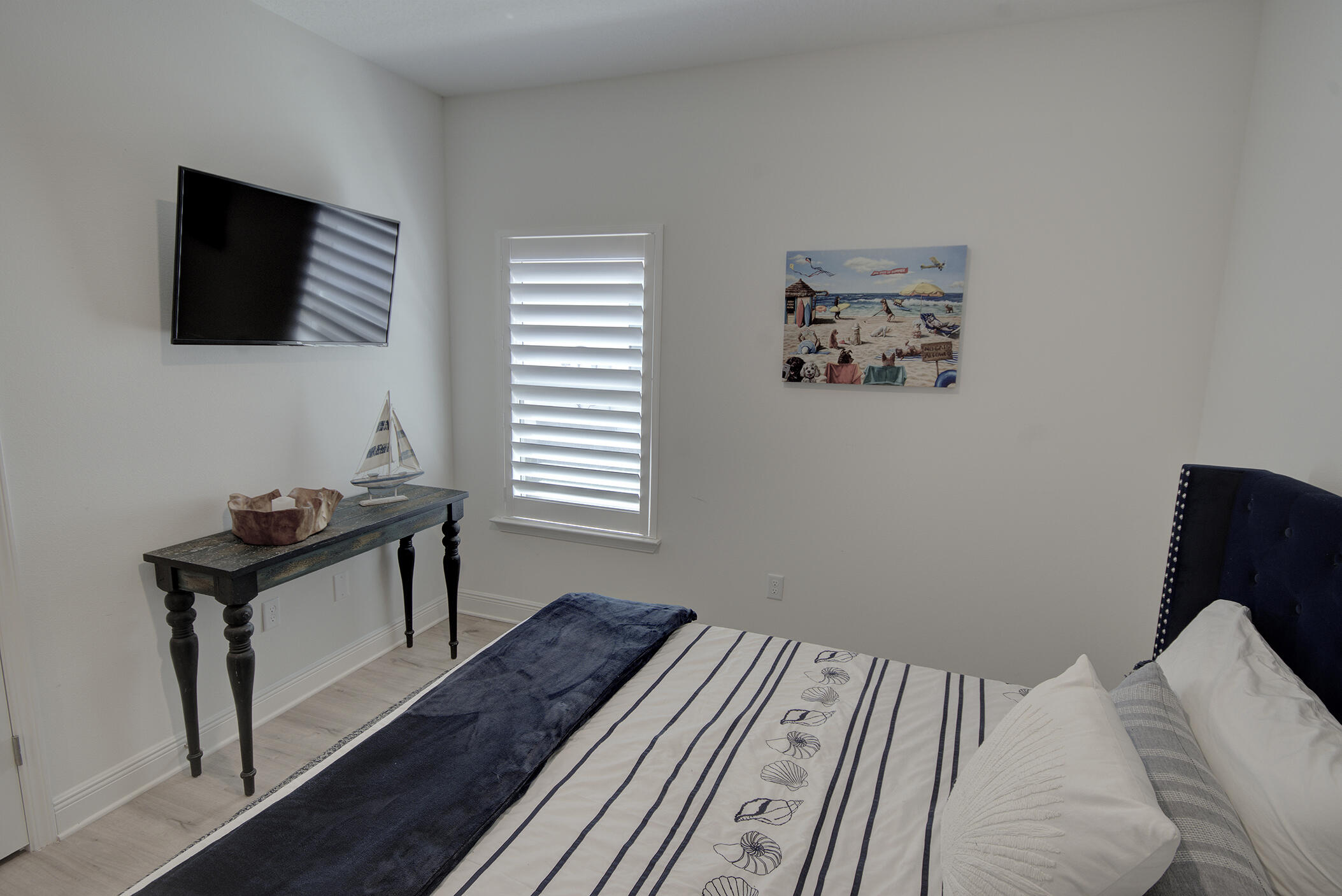 148 Piper Cove Santa Rosa Beach, FL 32459 - Photo 22 of 35 a bedroom with a bed and a flat screen tv