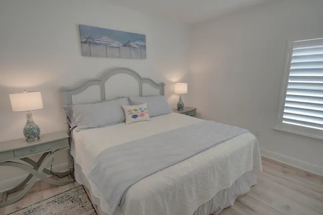 a bedroom with bed and a window