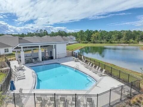 148 Piper Cove Santa Rosa Beach, FL 32459 - Photo 29 of 35 a view of a house with pool and a chairs