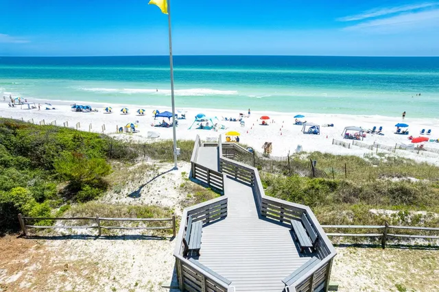 a view of a swimming pool with a yard