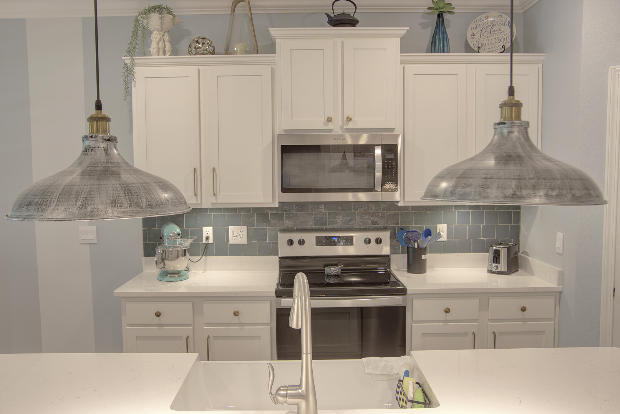 148 Piper Cove Santa Rosa Beach, FL 32459 - Photo 7 of 35 a kitchen with stainless steel appliances a stove a sink and a refrigerator