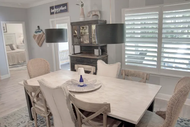 a dining room with furniture and window