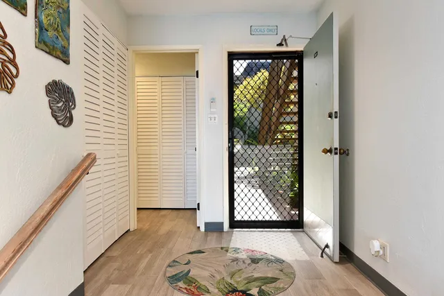 a view of entryway with wooden floor