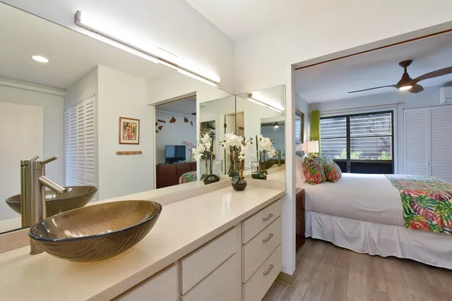 a bedroom with a bed and a dresser