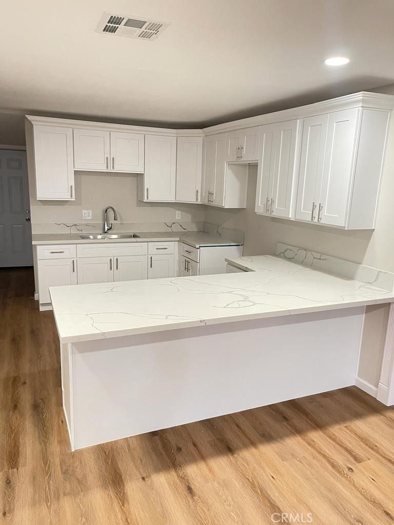 a kitchen with a cabinets and window