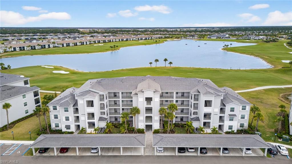43985 Boardwalk Loop, Unit 2115 Punta Gorda, FL 33982 - Photo 1 of 28 a view of a city with lawn chairs