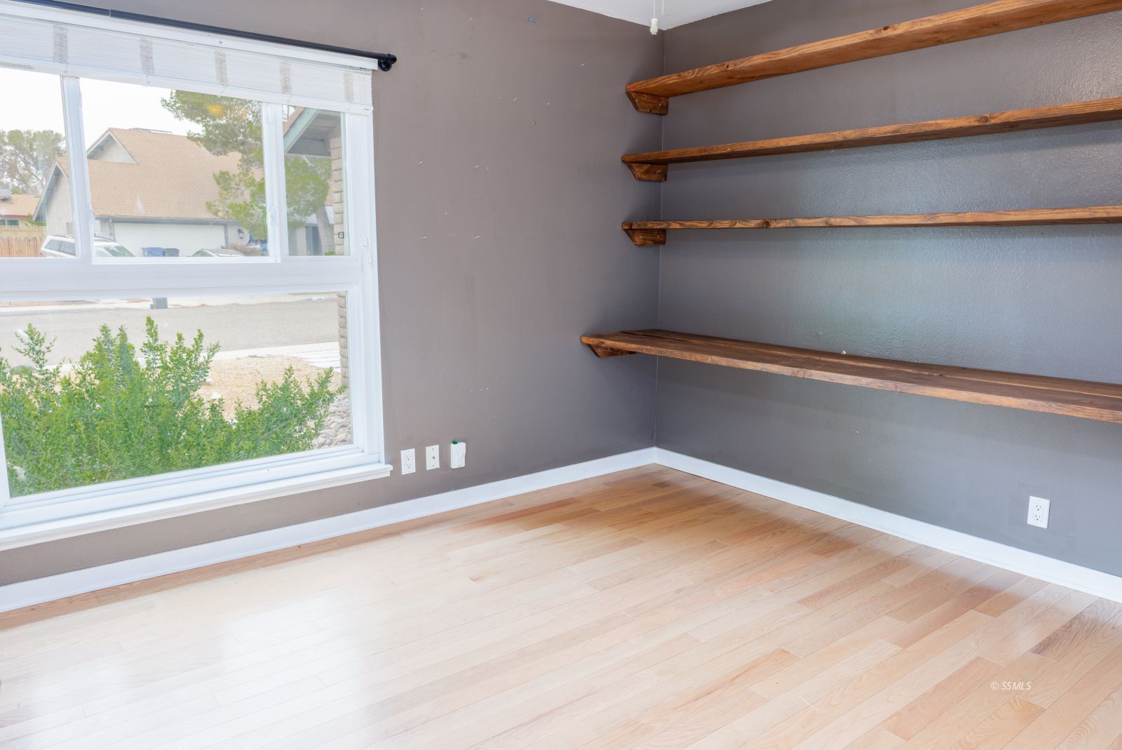 921 North Sierra View Street Ridgecrest, CA 93555 - Photo 16 of 27 a view of a small space with wooden floor and a window