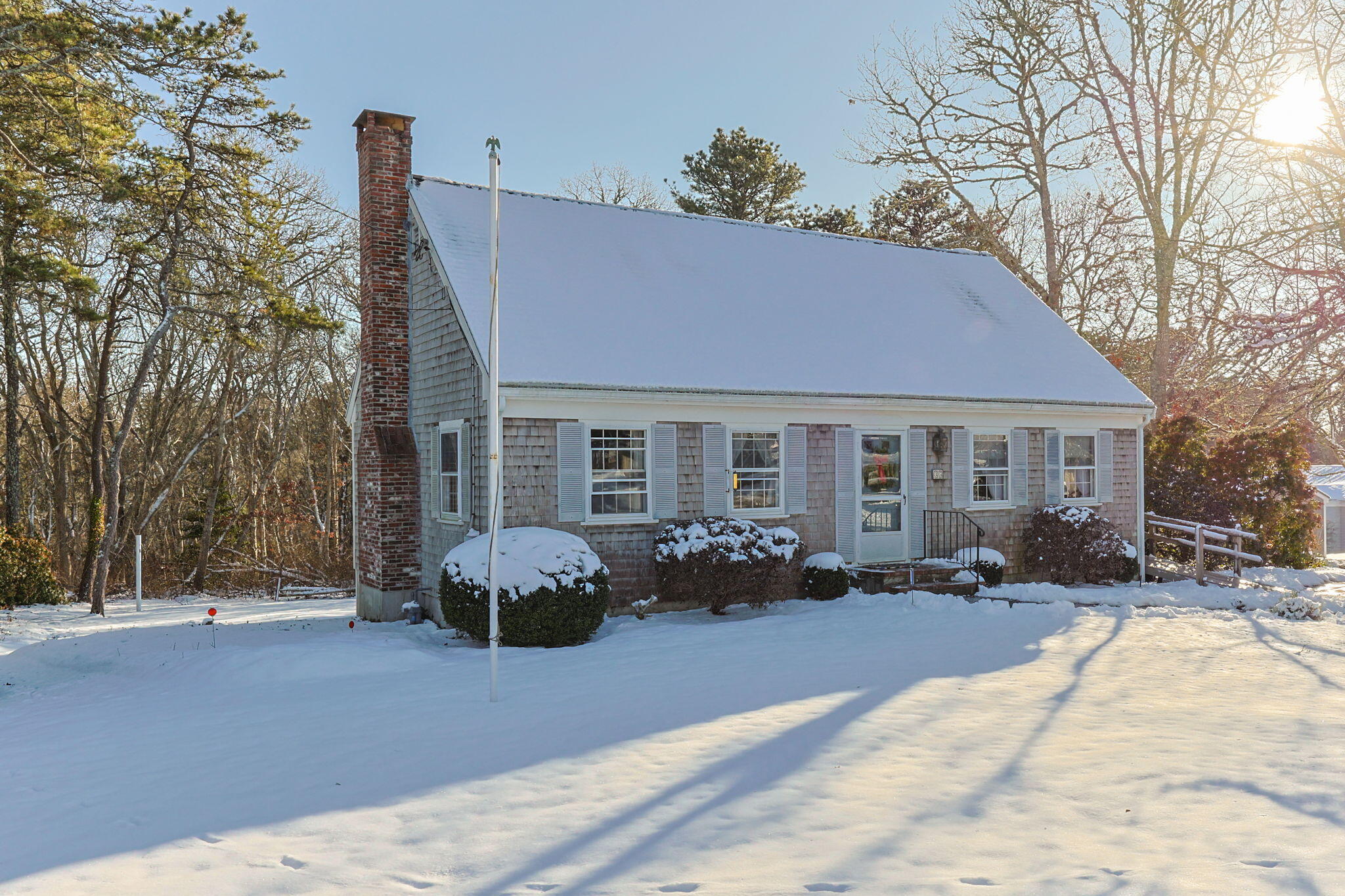 a front view of house with yard outdoor seating and barbeque oven