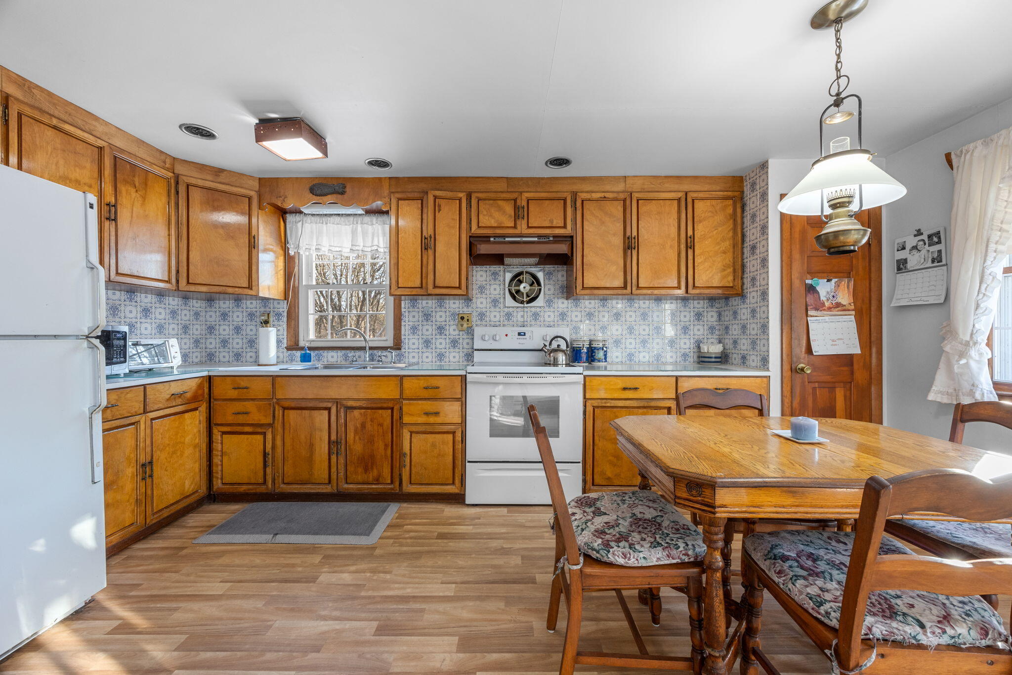 35 Wendys Way Harwich, MA 02645 - Photo 12 of 33 a kitchen with granite countertop wooden cabinets and granite counter tops