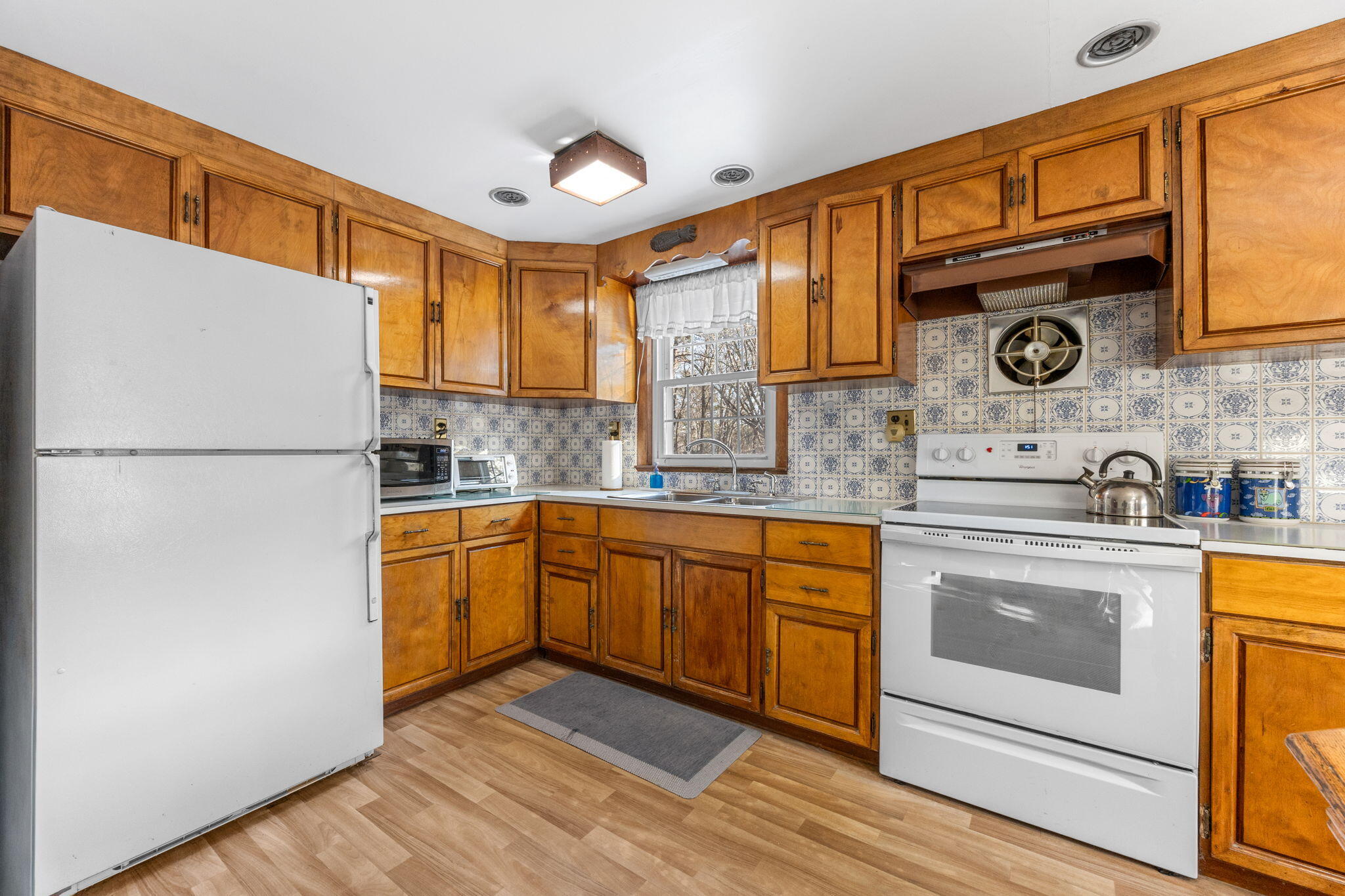 35 Wendys Way Harwich, MA 02645 - Photo 13 of 33 a kitchen with stainless steel appliances granite countertop a refrigerator a stove and a sink