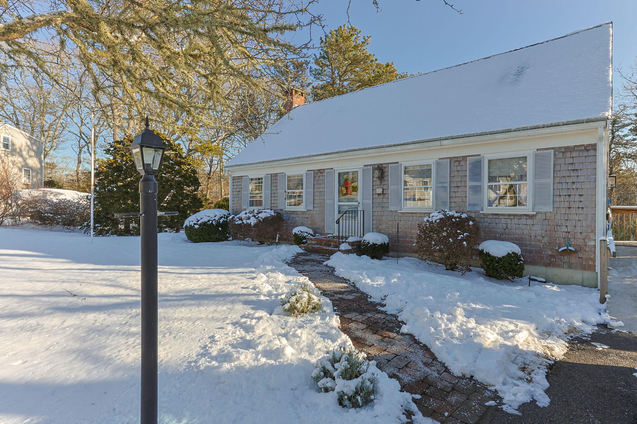 35 Wendys Way Harwich, MA 02645 - Photo 2 of 33 a backyard of a house with yard table and chairs
