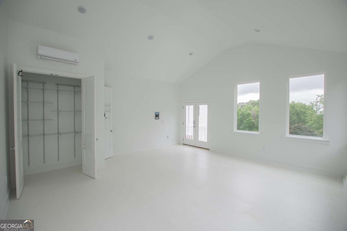 1745 Stripling Chapel Road Carrollton, GA 30116 - Photo 43 of 87 an empty room with windows and closet