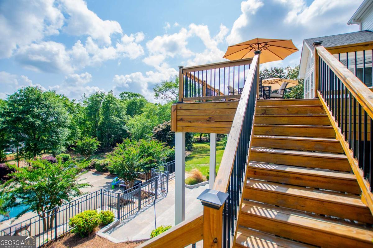 1745 Stripling Chapel Road Carrollton, GA 30116 - Photo 57 of 87 a view of staircase with railing and a potted plant