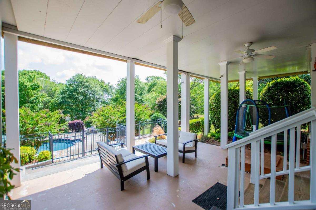 1745 Stripling Chapel Road Carrollton, GA 30116 - Photo 65 of 87 a balcony with furniture and garden view