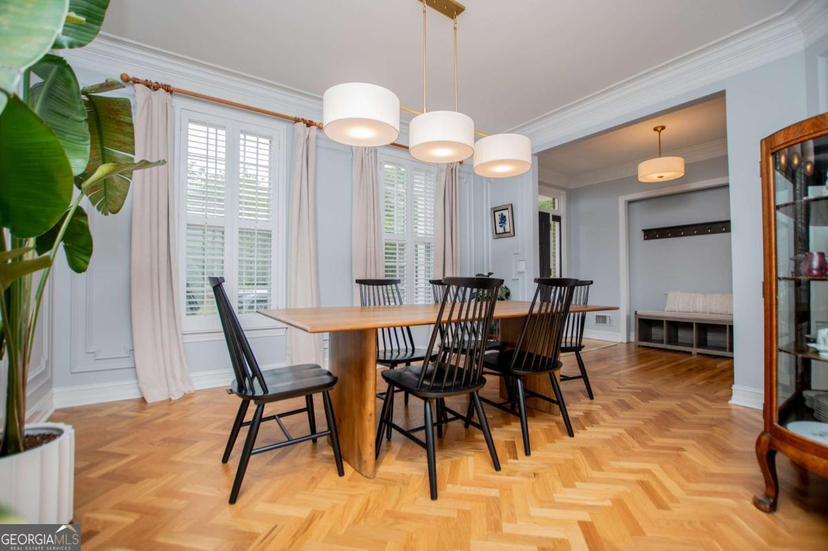 1745 Stripling Chapel Road Carrollton, GA 30116 - Photo 7 of 87 a view of a dining room with furniture and a potted plant