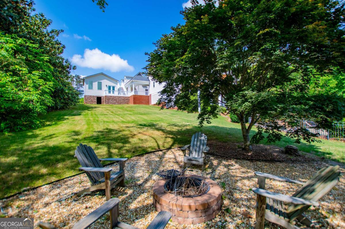 1745 Stripling Chapel Road Carrollton, GA 30116 - Photo 72 of 87 a view of a chairs and table in the garden