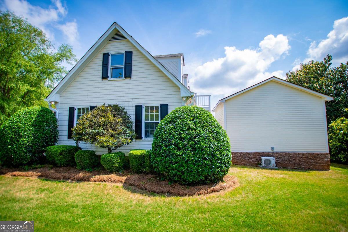 1745 Stripling Chapel Road Carrollton, GA 30116 - Photo 78 of 87 a view of a house with garden and plants
