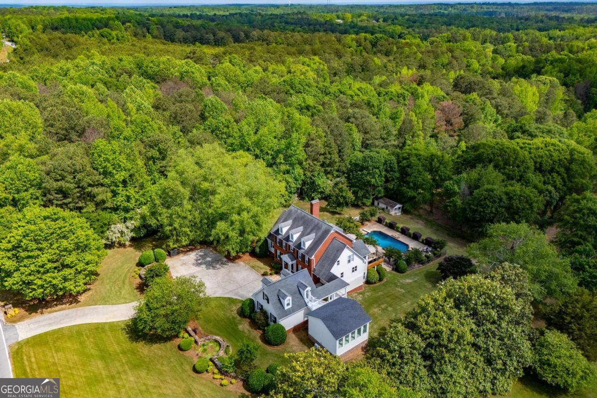 1745 Stripling Chapel Road Carrollton, GA 30116 - Photo 82 of 87 an aerial view of a house with a yard