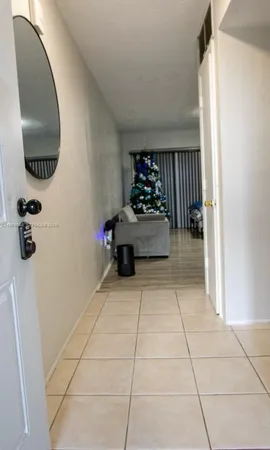 a hallway with a washer and dryer