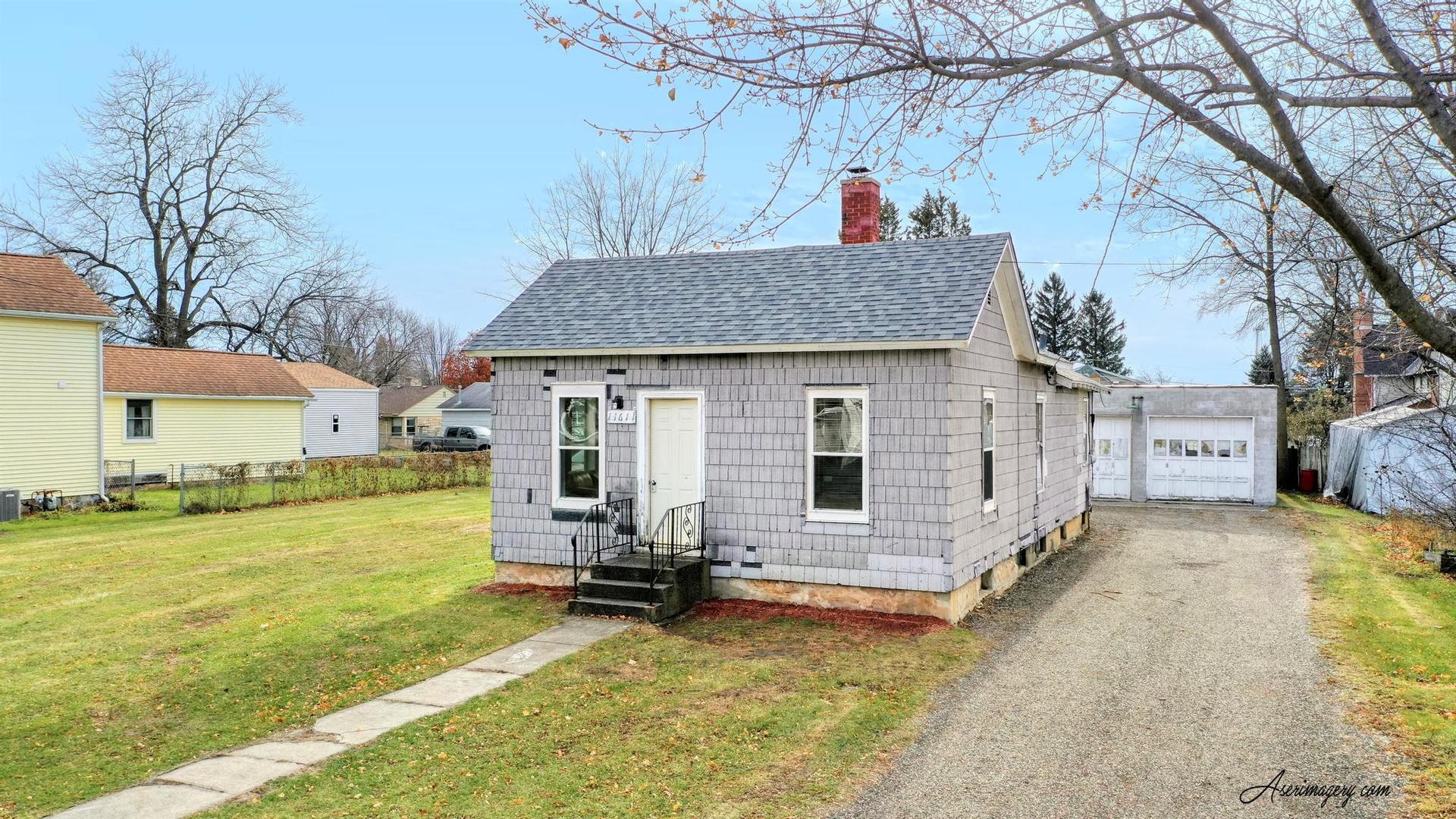 a view of a house with backyard porch and sitting area