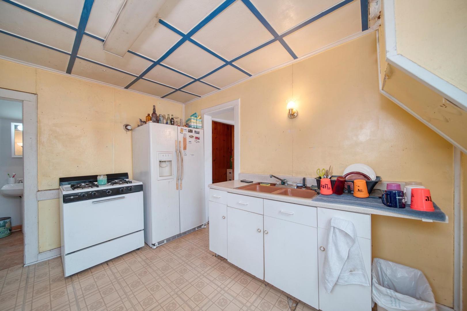11611 Maple Avenue Hebron, IL 60034 - Photo 14 of 17 a kitchen with refrigerator and cabinets