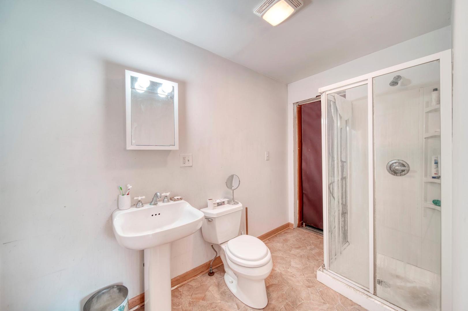 11611 Maple Avenue Hebron, IL 60034 - Photo 15 of 17 a bathroom with a sink toilet and shower