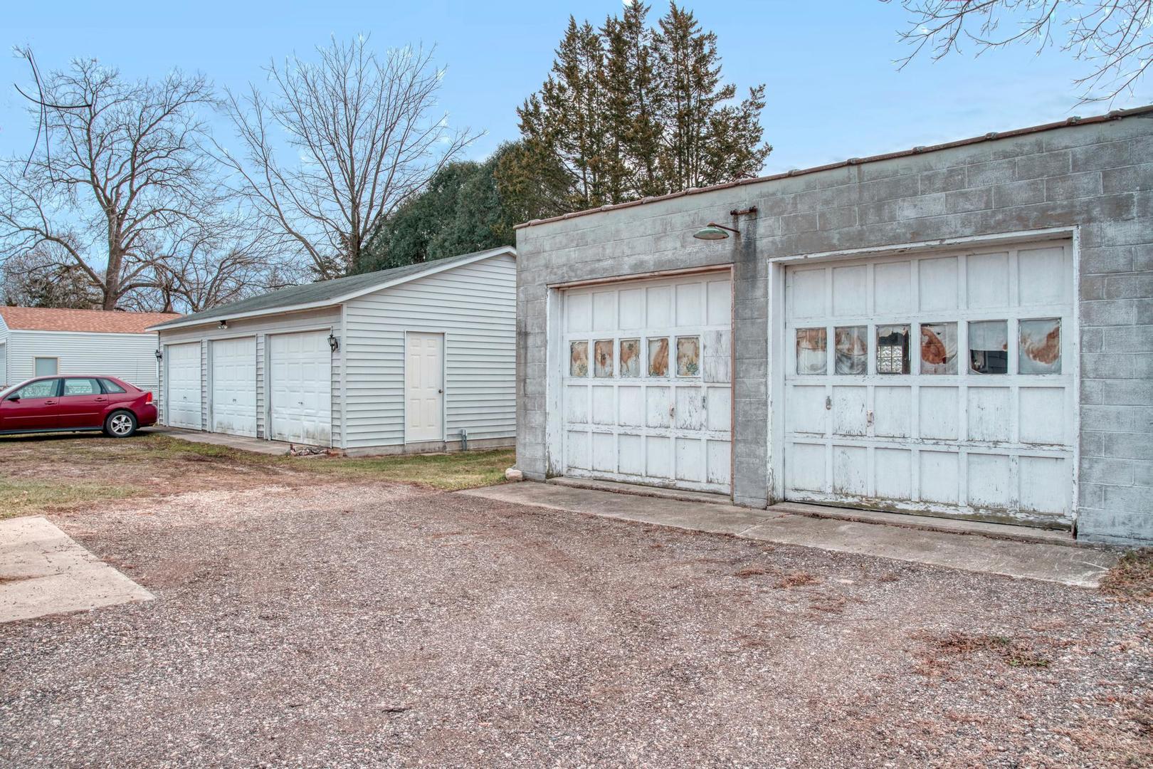11611 Maple Avenue Hebron, IL 60034 - Photo 3 of 17 a view of a house with a yard and garage
