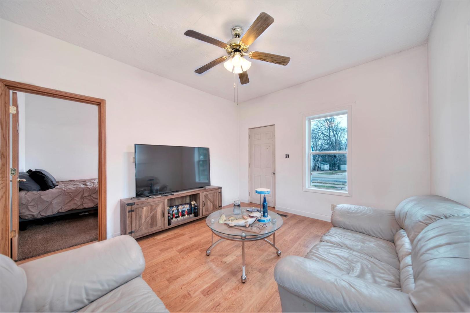 11611 Maple Avenue Hebron, IL 60034 - Photo 7 of 17 a living room with furniture and a flat screen tv