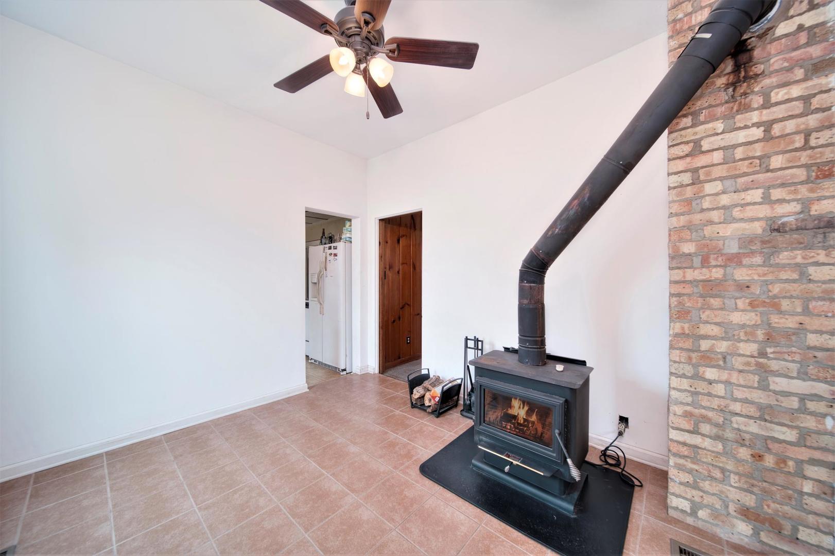 11611 Maple Avenue Hebron, IL 60034 - Photo 9 of 17 a view of an empty room with wooden floor