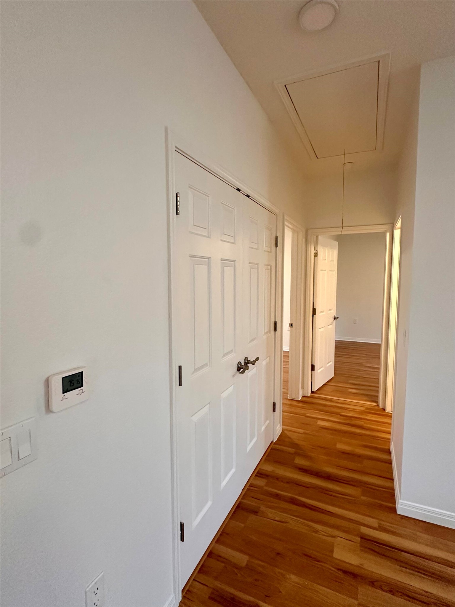 1122 Mansell Avenue Austin, TX 78721 - Photo 12 of 29 a view of a hallway with wooden floor and a bathroom