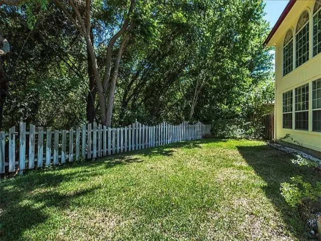 a view of backyard with a garden and entertaining space