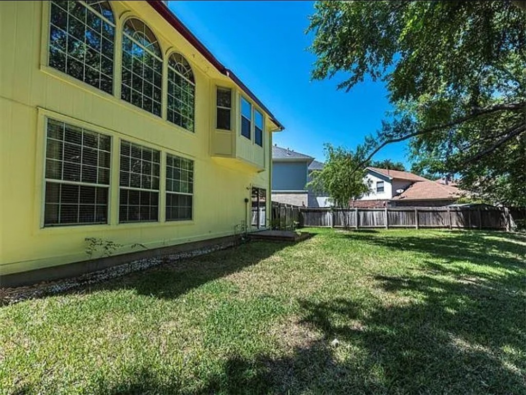 16303 Ascent Cove Pflugerville, TX 78660 - Photo 13 of 37 a view of a house with a yard and potted plants