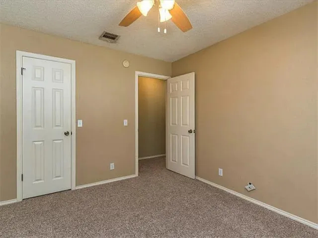 an empty room with a bathroom