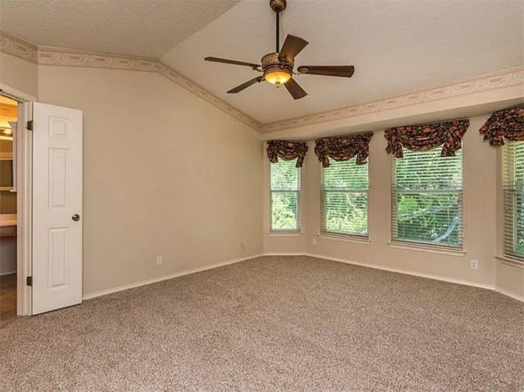 16303 Ascent Cove Pflugerville, TX 78660 - Photo 26 of 37 a view of room with a ceiling fan and window