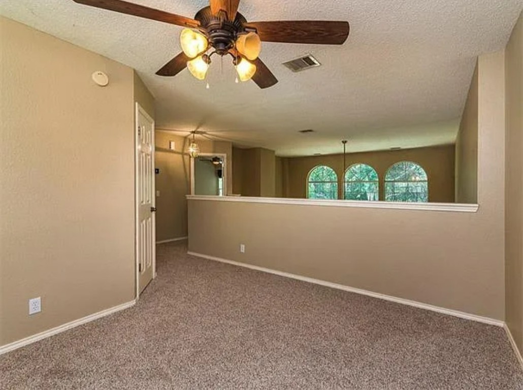 16303 Ascent Cove Pflugerville, TX 78660 - Photo 28 of 37 wooden floor in an empty room with a window
