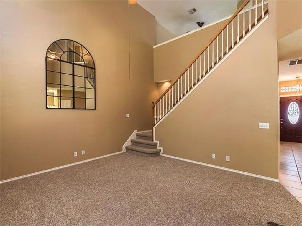 16303 Ascent Cove Pflugerville, TX 78660 - Photo 34 of 37 a view of entryway and hall with wooden floor