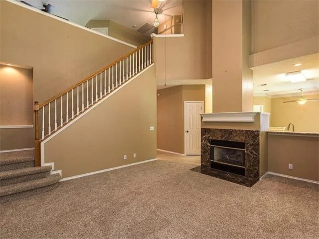 16303 Ascent Cove Pflugerville, TX 78660 - Photo 35 of 37 a view of empty room with fireplace and stairs