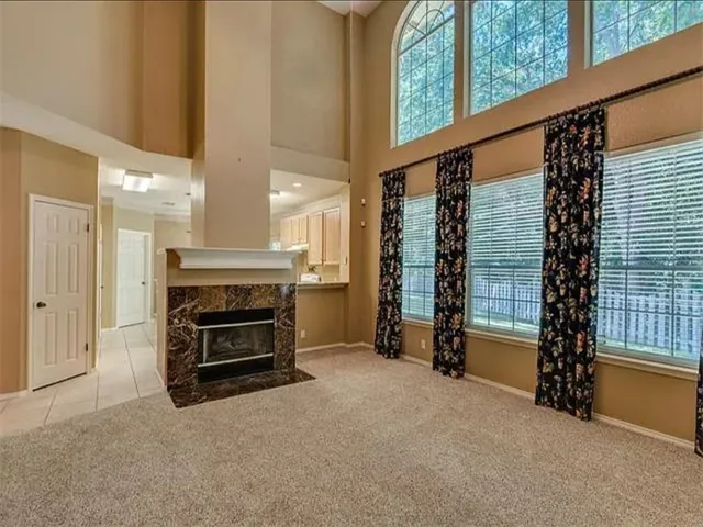 a view of livingroom with furniture and a fireplace
