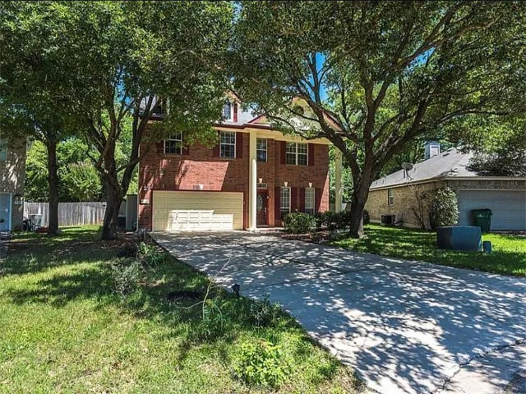 16303 Ascent Cove Pflugerville, TX 78660 - Photo 6 of 37 a view of a yard with plants and large trees