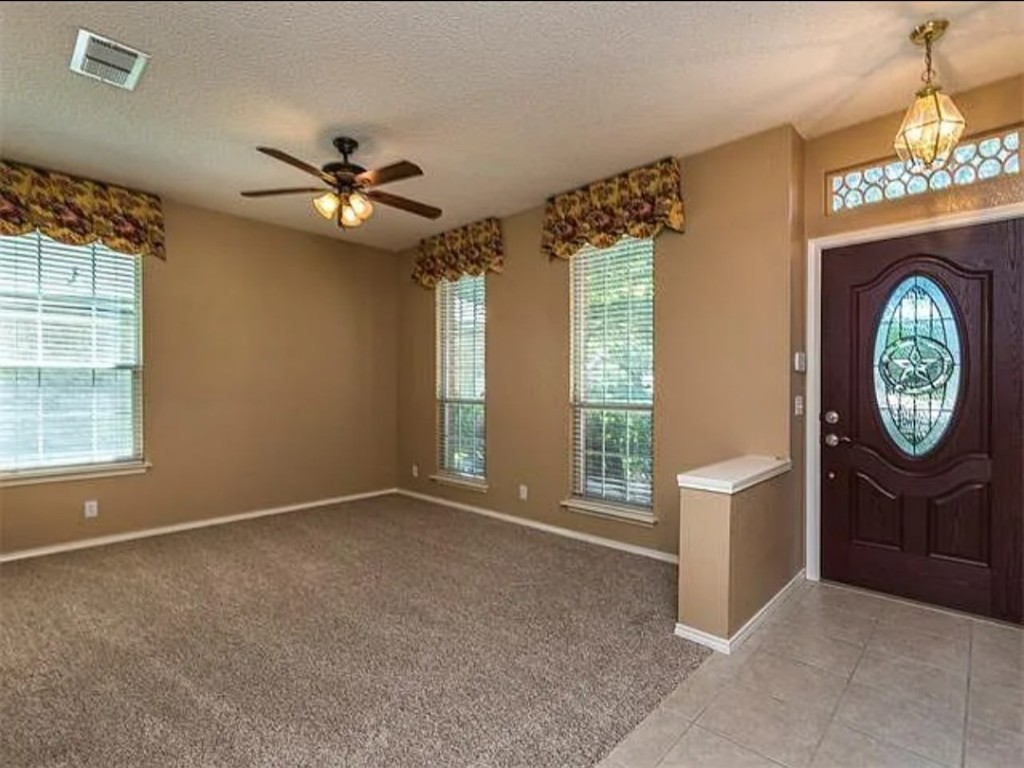16303 Ascent Cove Pflugerville, TX 78660 - Photo 8 of 37 a view of an empty room with a window