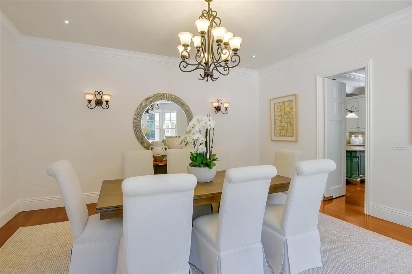 700 Patrol Road Woodside, CA 94062 - Photo 14 of 55 a view of a dining room with furniture and chandelier