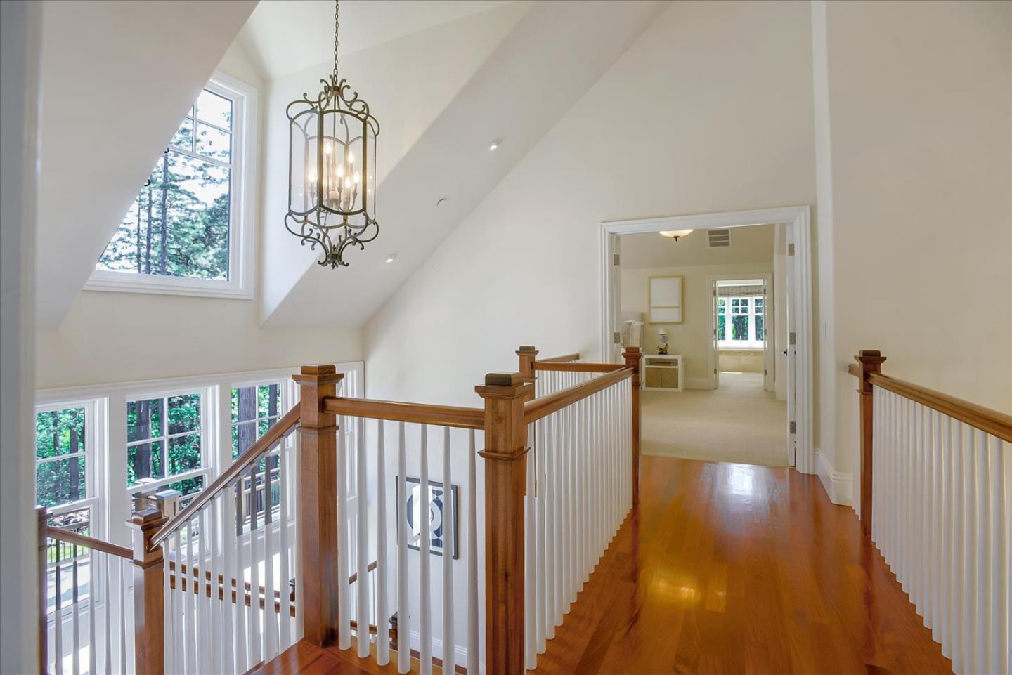 700 Patrol Road Woodside, CA 94062 - Photo 22 of 55 a view of a hallway with wooden floor and staircase