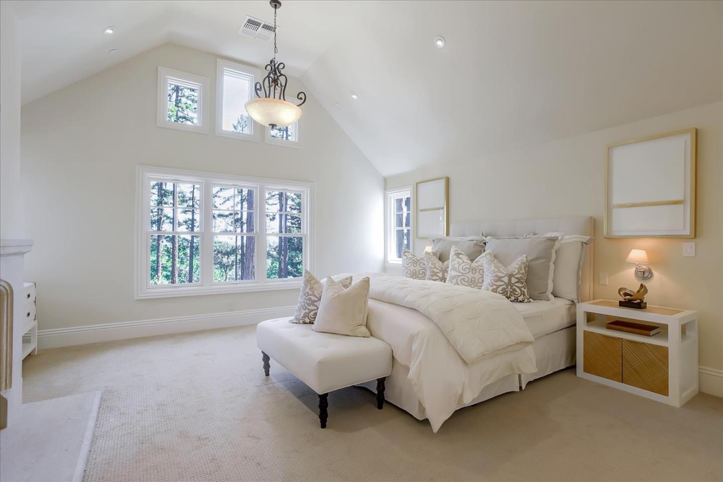 700 Patrol Road Woodside, CA 94062 - Photo 23 of 55 a spacious bedroom with a bed and a window