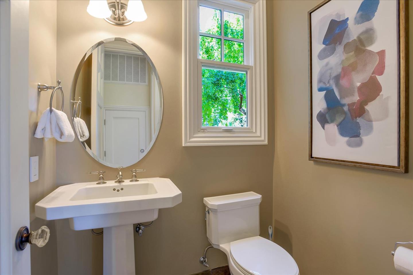 700 Patrol Road Woodside, CA 94062 - Photo 40 of 55 a bathroom with a toilet sink and mirror