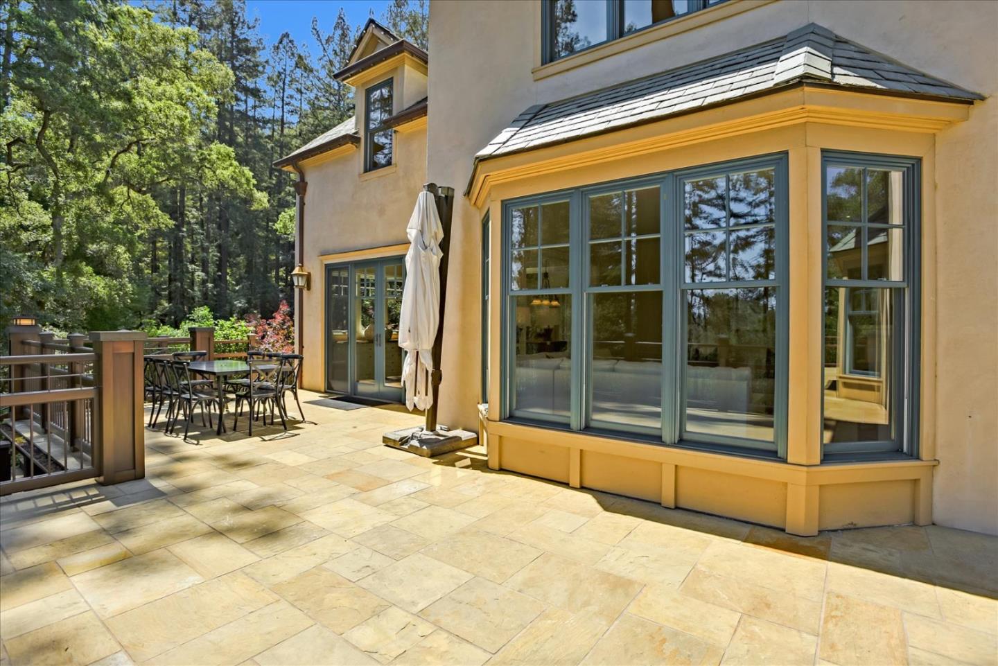 700 Patrol Road Woodside, CA 94062 - Photo 43 of 55 a view of a house with glass door and glass windows