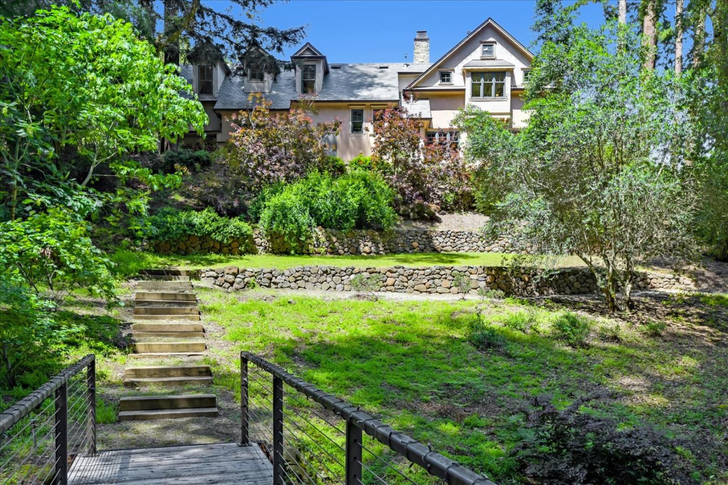 700 Patrol Road Woodside, CA 94062 - Photo 48 of 55 a view of a garden with a fountain