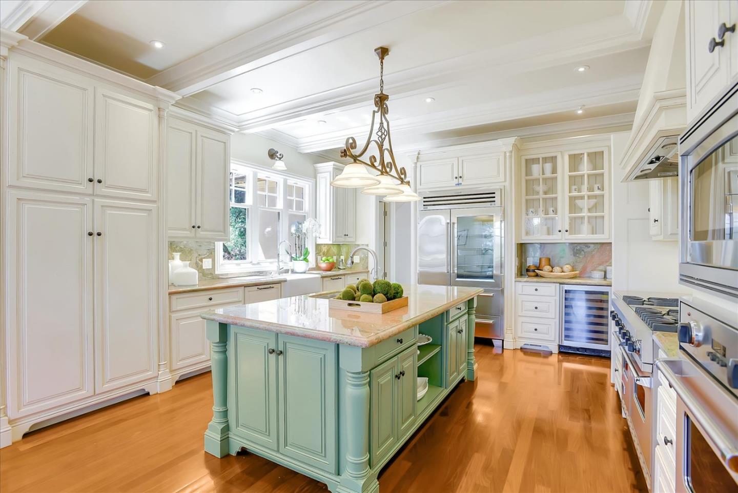 700 Patrol Road Woodside, CA 94062 - Photo 7 of 55 a kitchen with kitchen island granite countertop a stove and a wooden floors