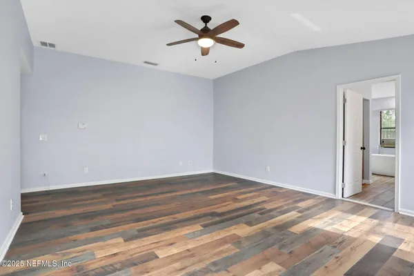 a view of room with a ceiling fan