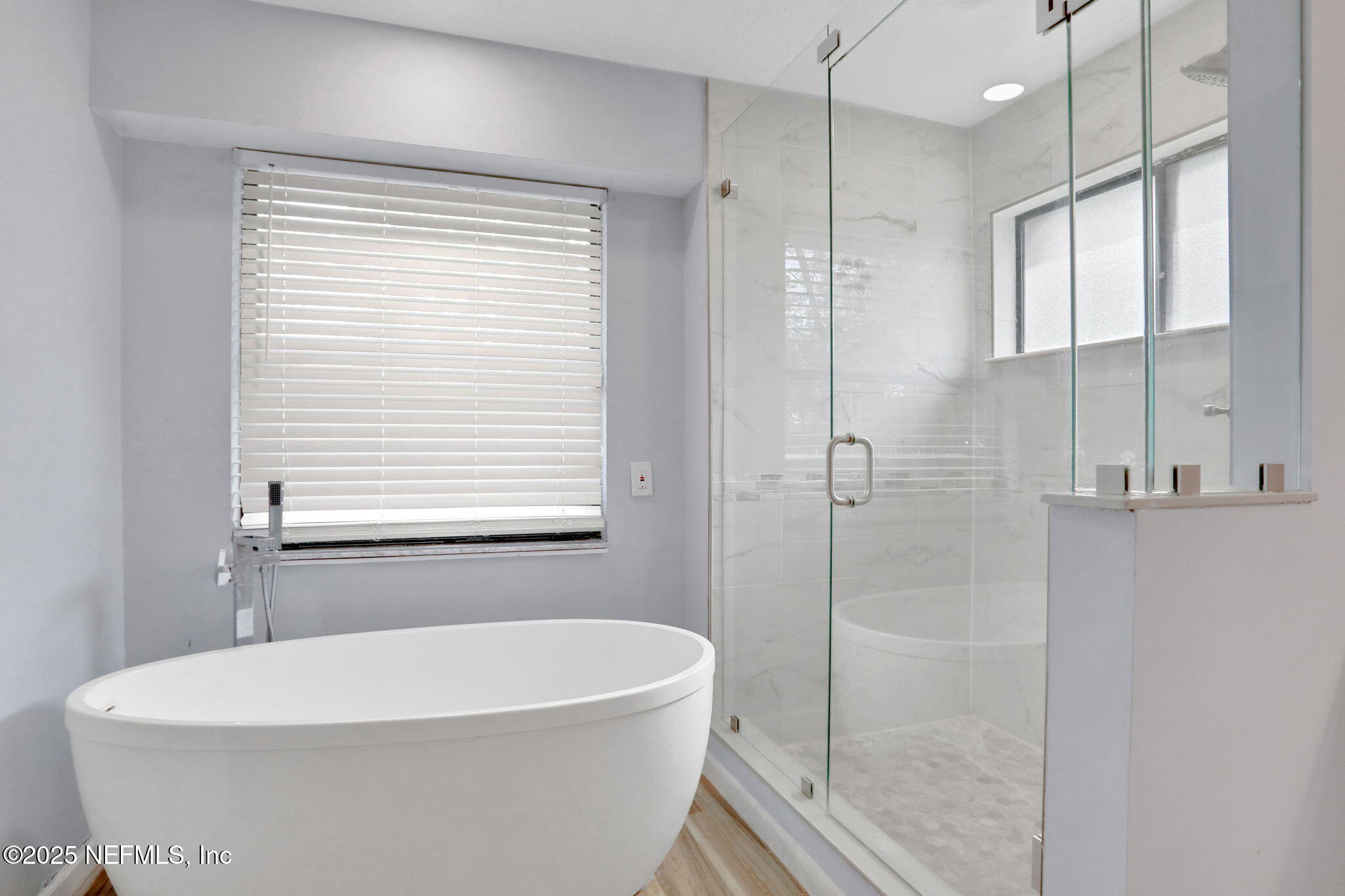 12228 Smoke Ridge Circle South Jacksonville, FL 32225 - Photo 29 of 50 a white bath tub sitting next to a shower